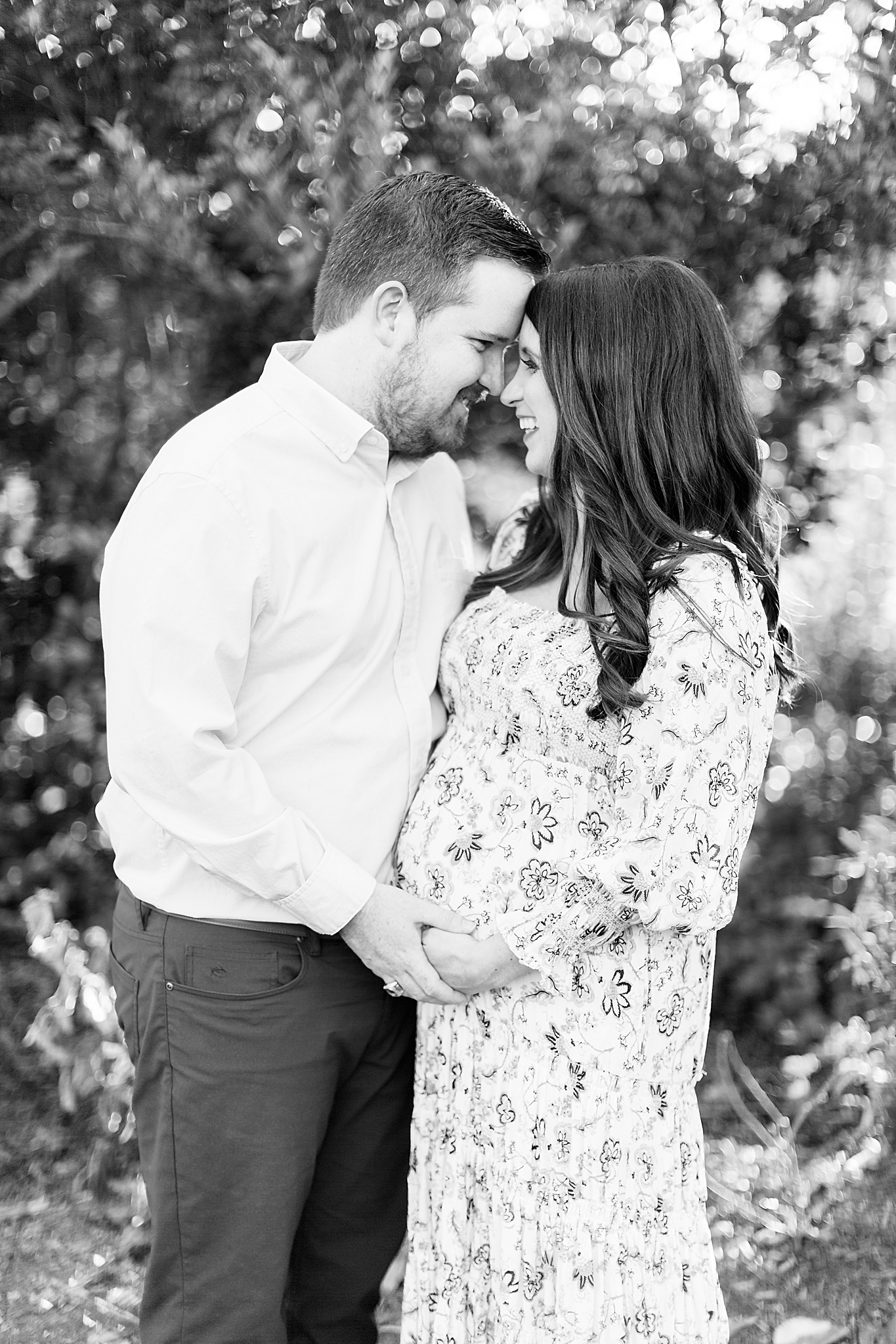 Reynolda Village maternity session with couple laughing together
