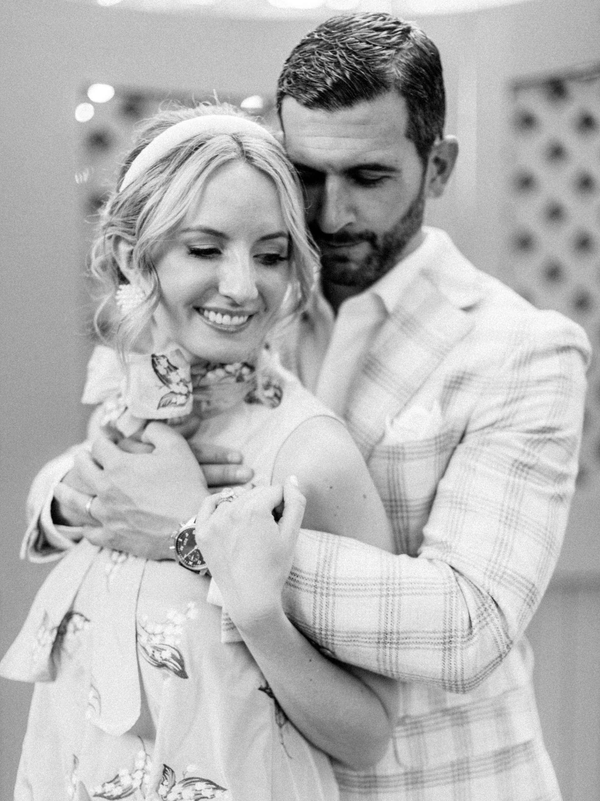 husband hugs wife during Charleston vow renewal