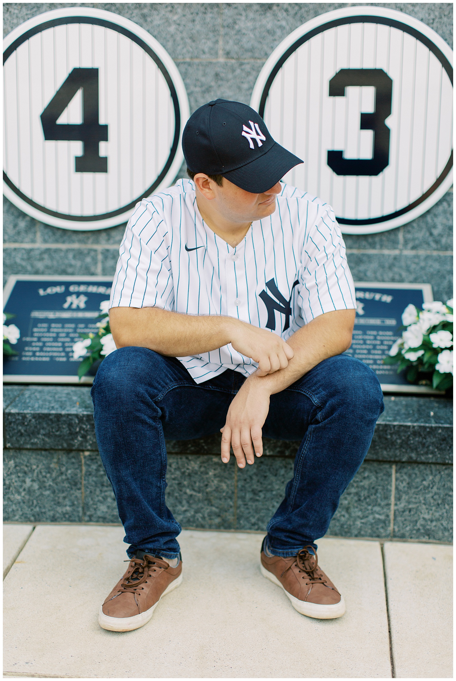groom sits by memorial at Yankee Stadium 