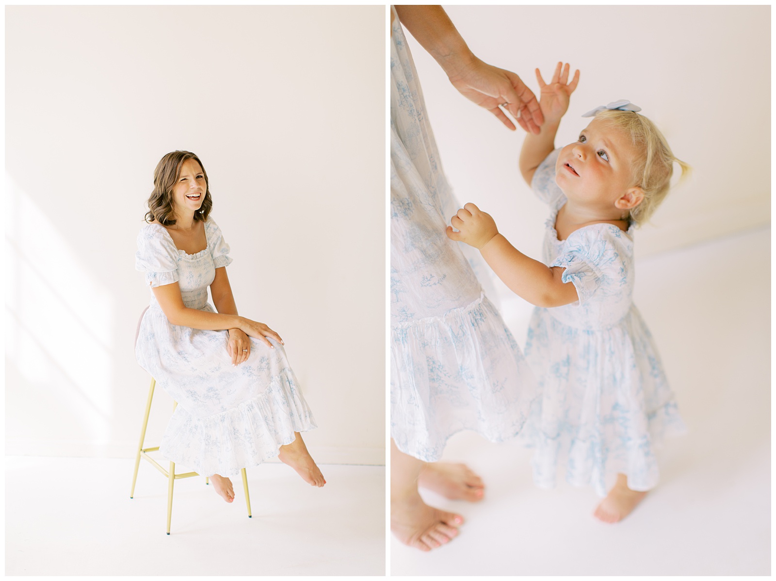 mom sits on stool while toddler in matching dress reaches for her