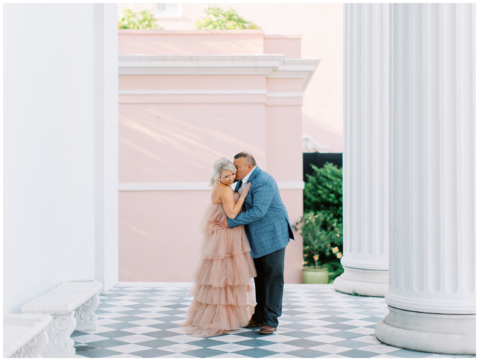 engaged couple kisses during Downtown Charleston engagement session