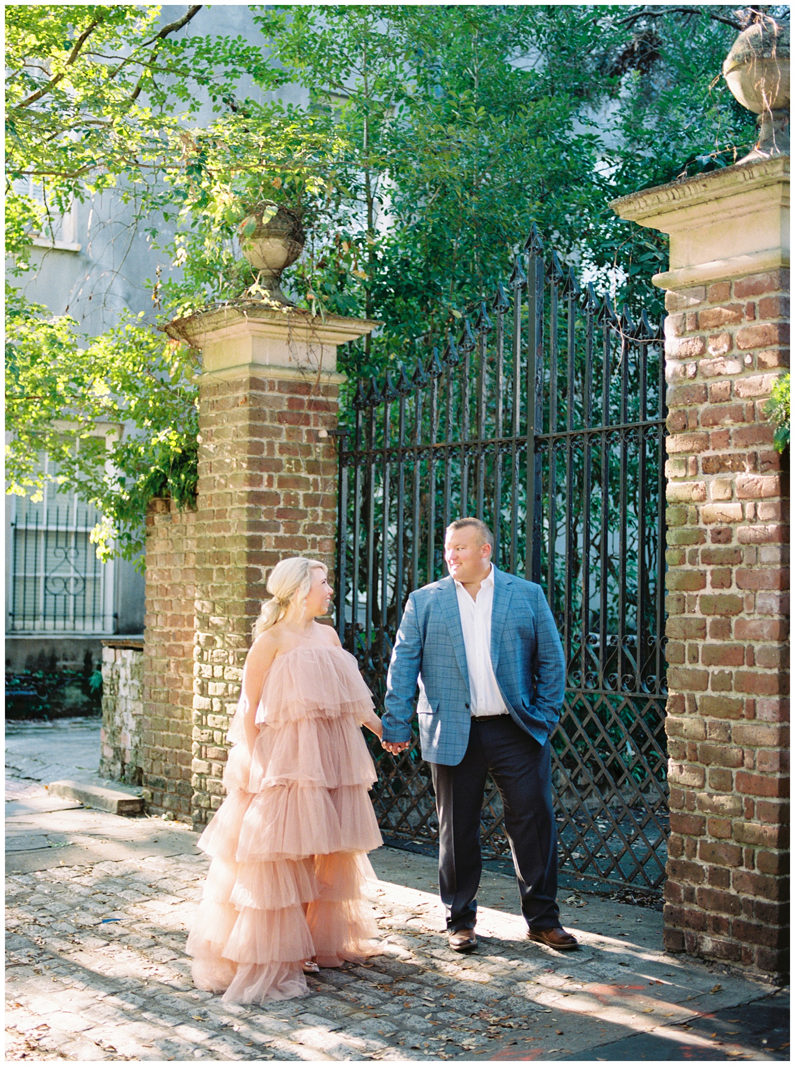 Downtown Charleston engagement session with bride in statement dress from Untamed Petals