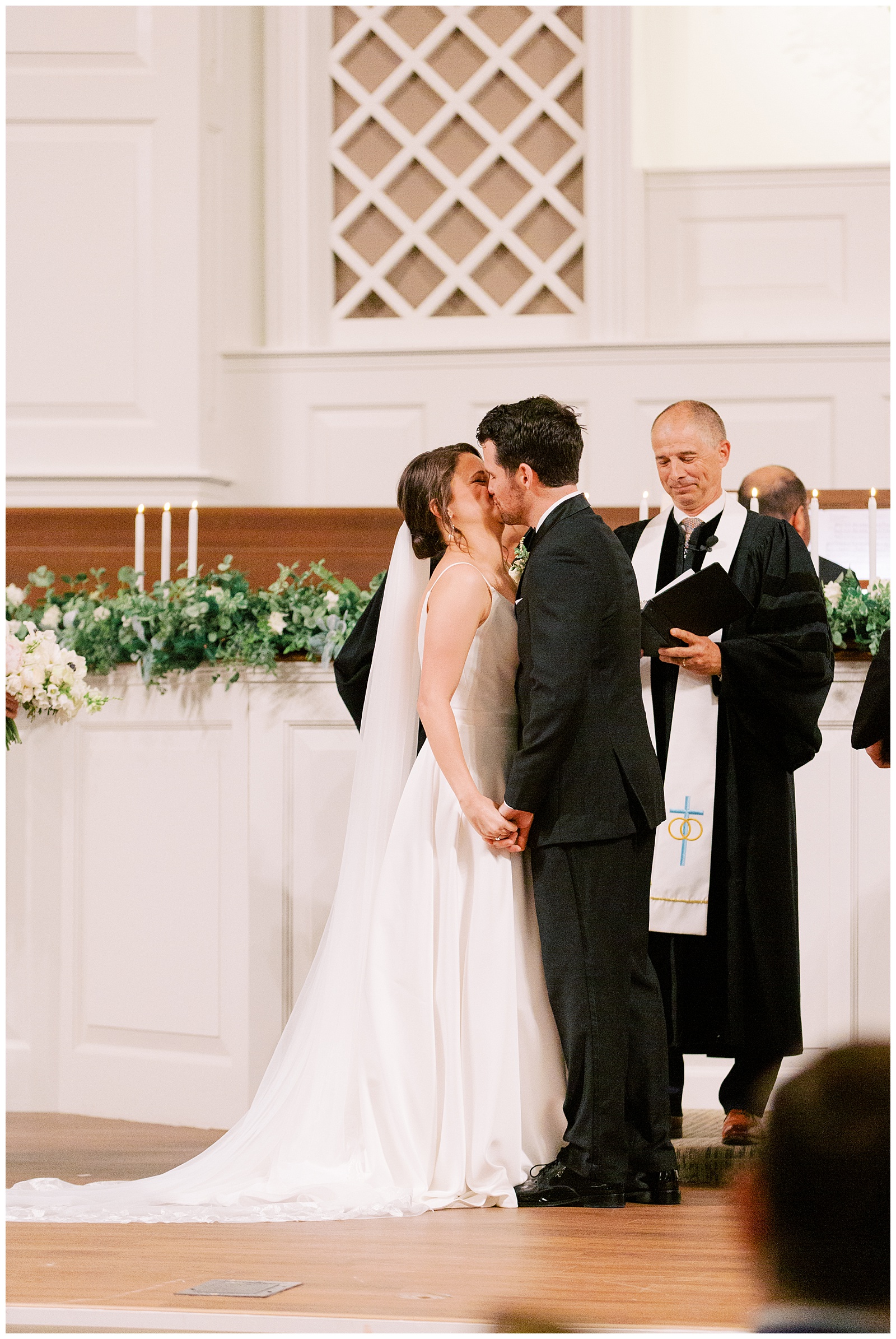 bride and groom kiss after traditional wedding ceremony in Charlotte NC
