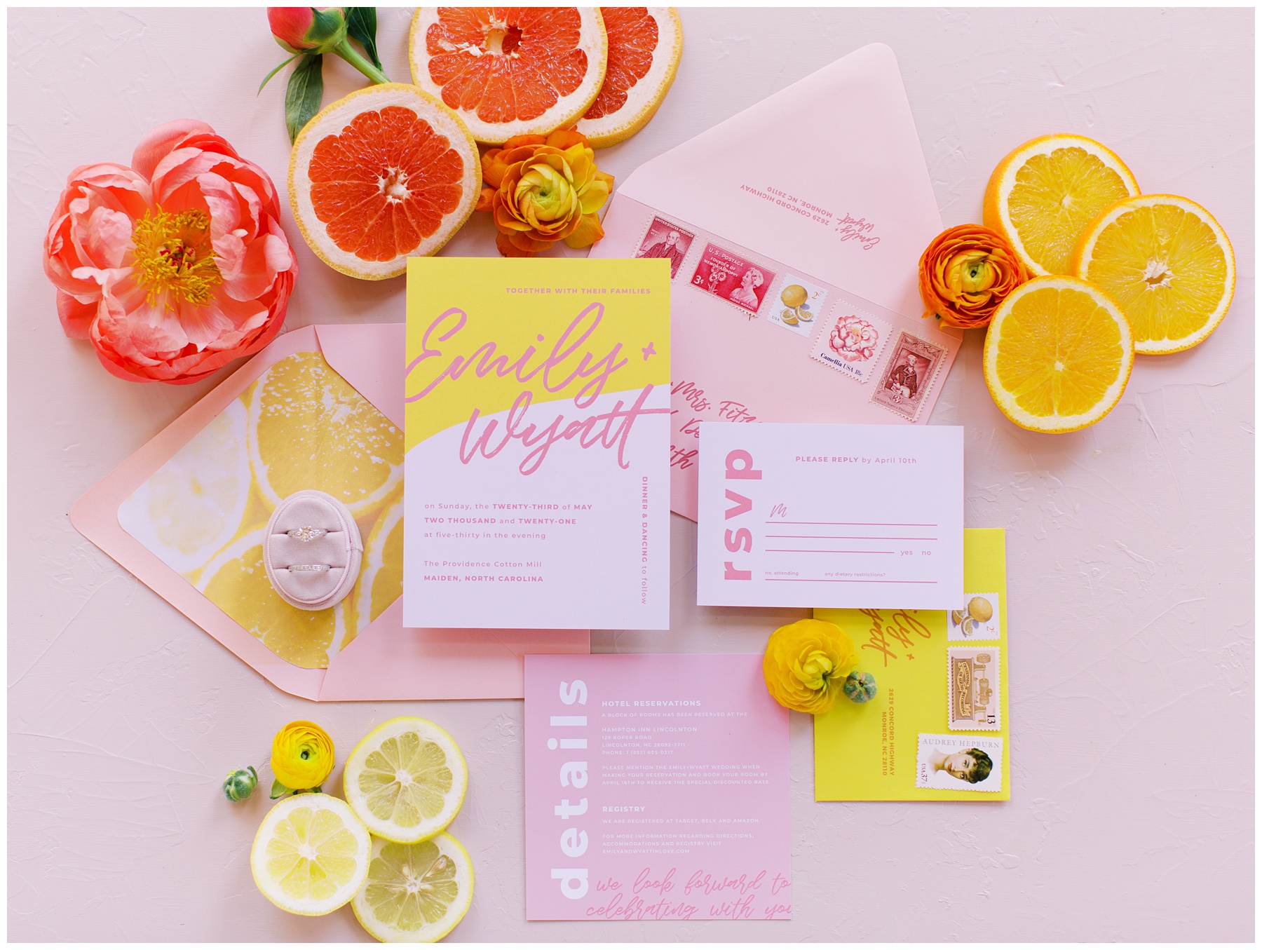 bright pink and yellow invitation suite for citrus inspired wedding at Providence Cotton Mill 