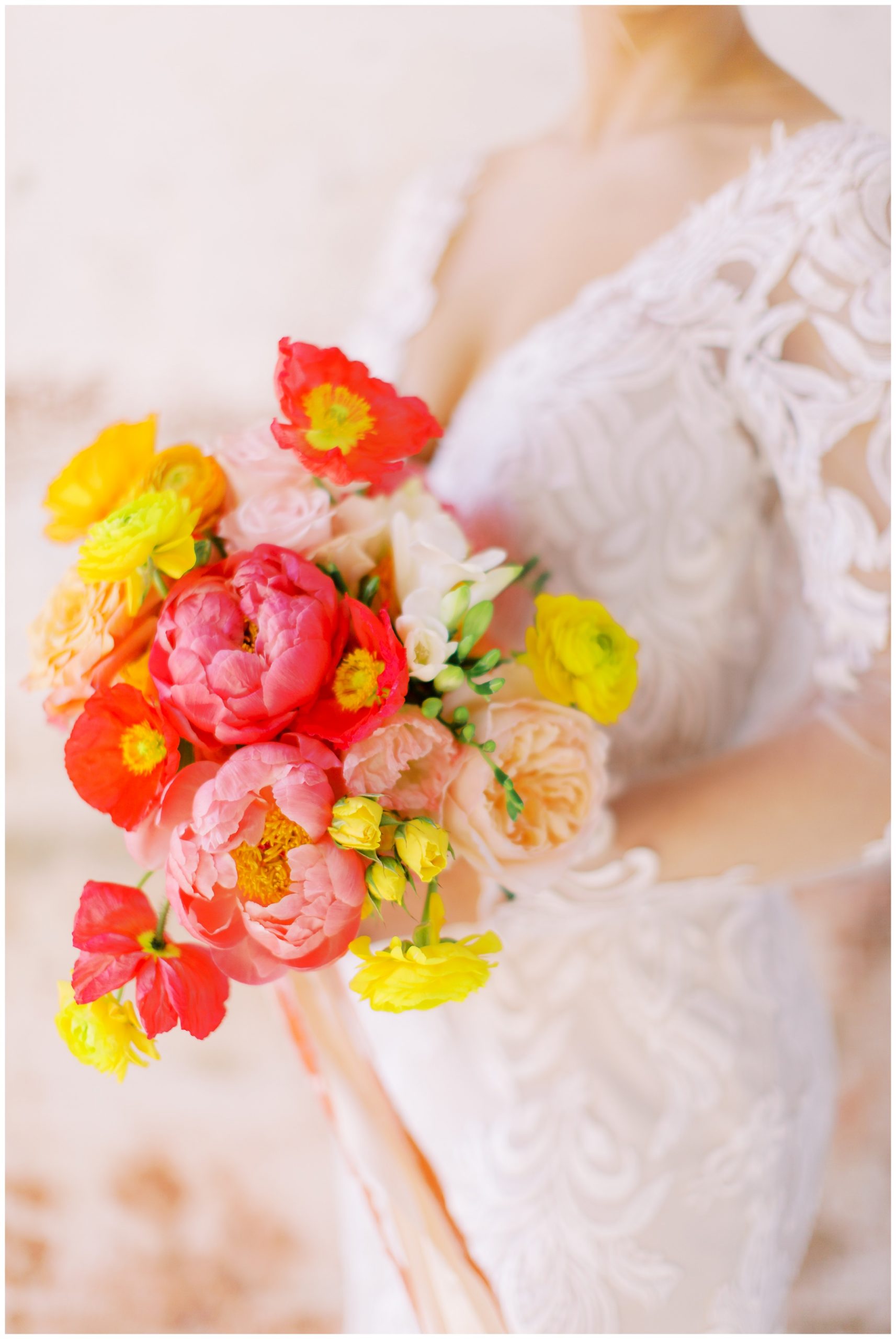 bright's bride bouquet with pink, yellow, and orange flowers 