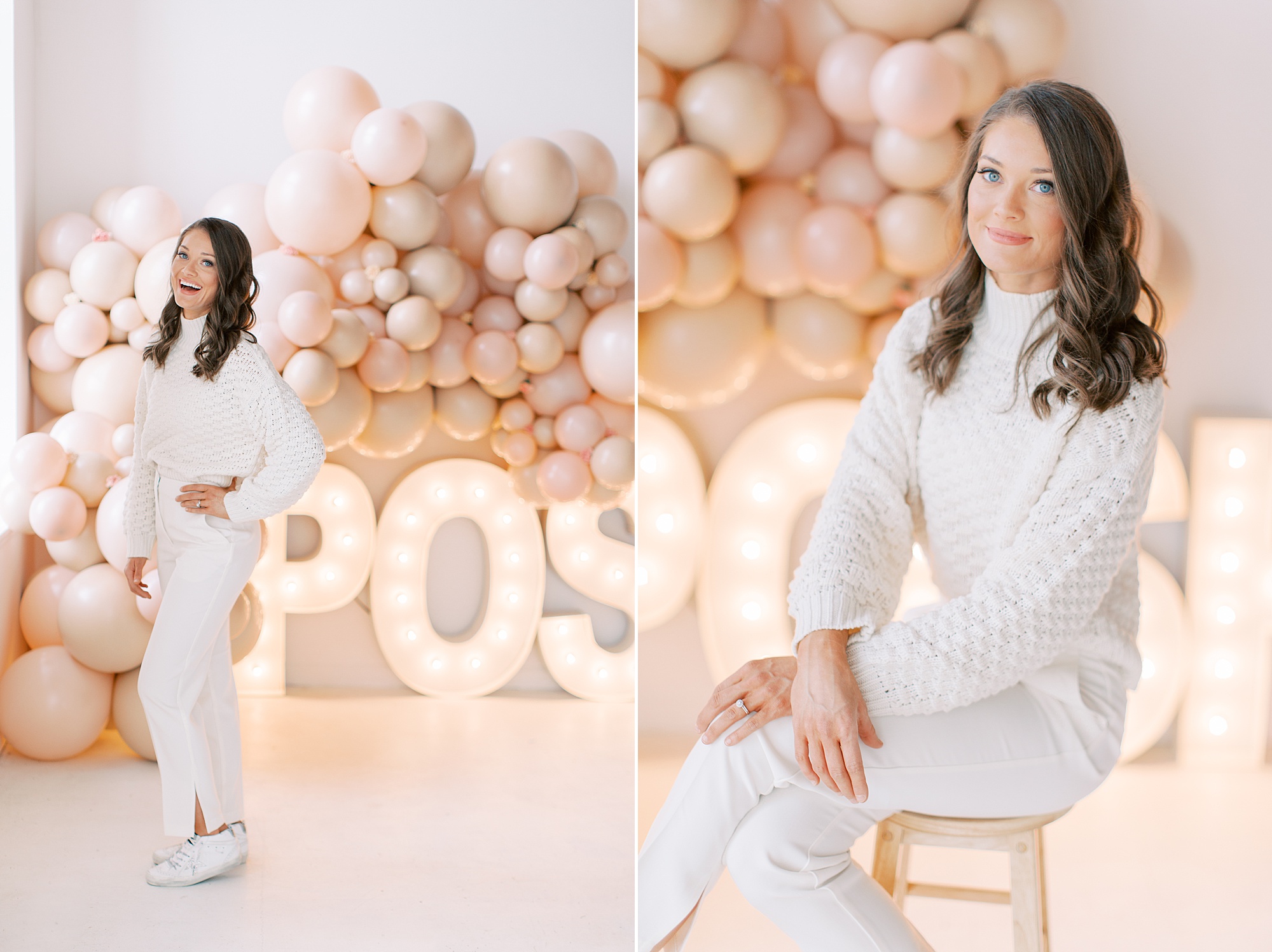 woman sits by balloon arch during studio branding session