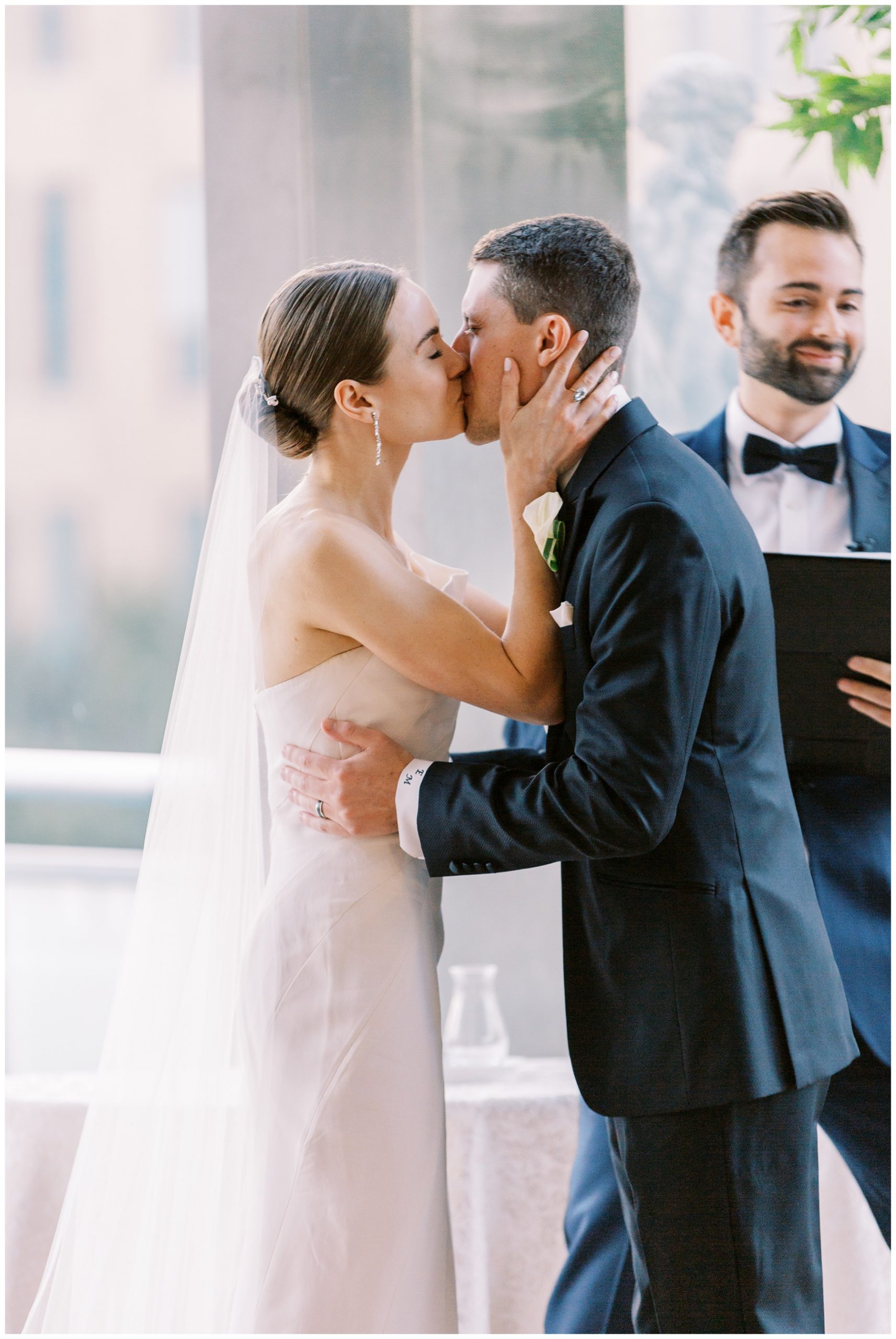 bride and groom kiss during Foundation for the Carolinas wedding ceremony