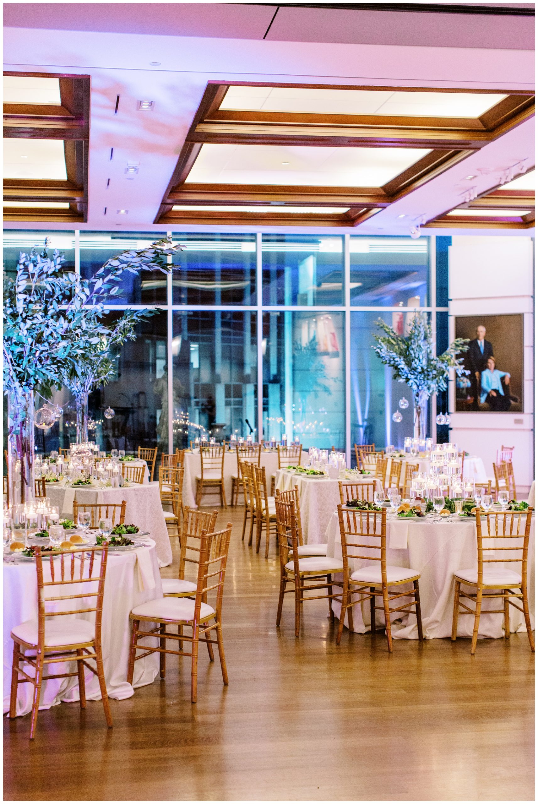 Foundation for the Carolinas wedding reception with gold chairs and white table cloths 
