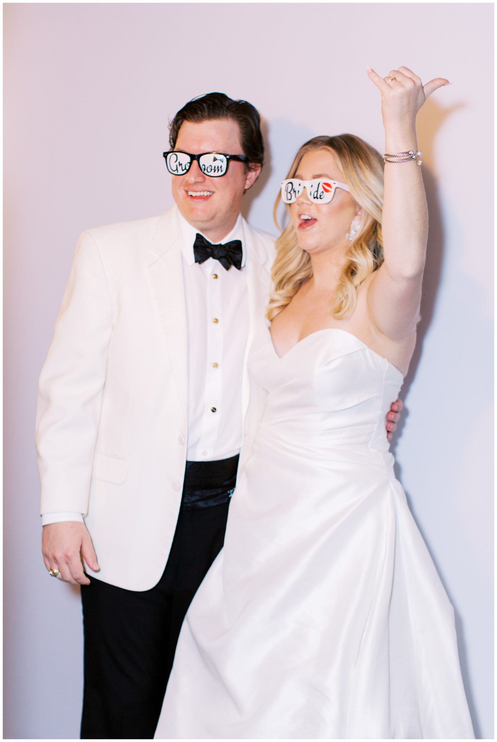 bride and groom wear fun glasses for party in Charlotte NC 