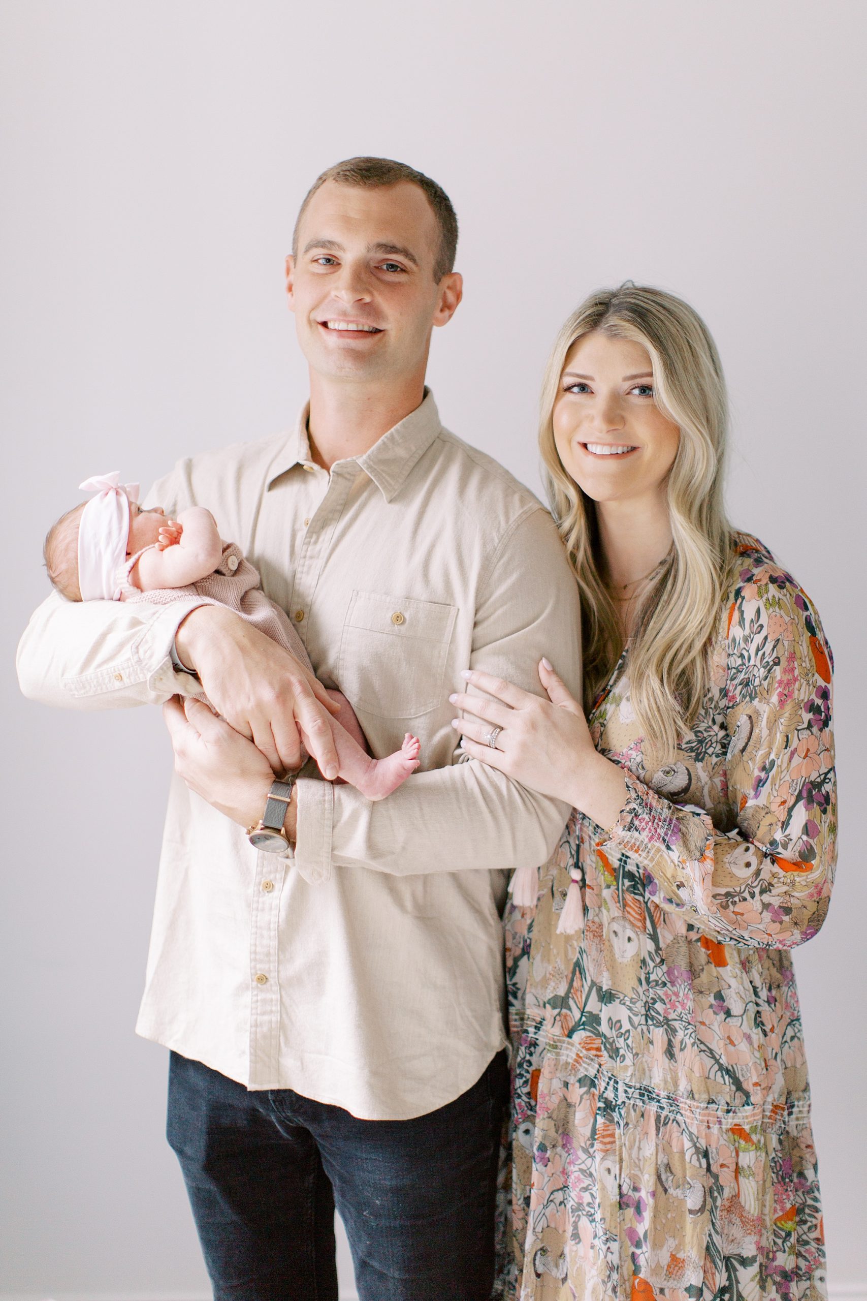parents hold new baby during at home Charlotte newborn session