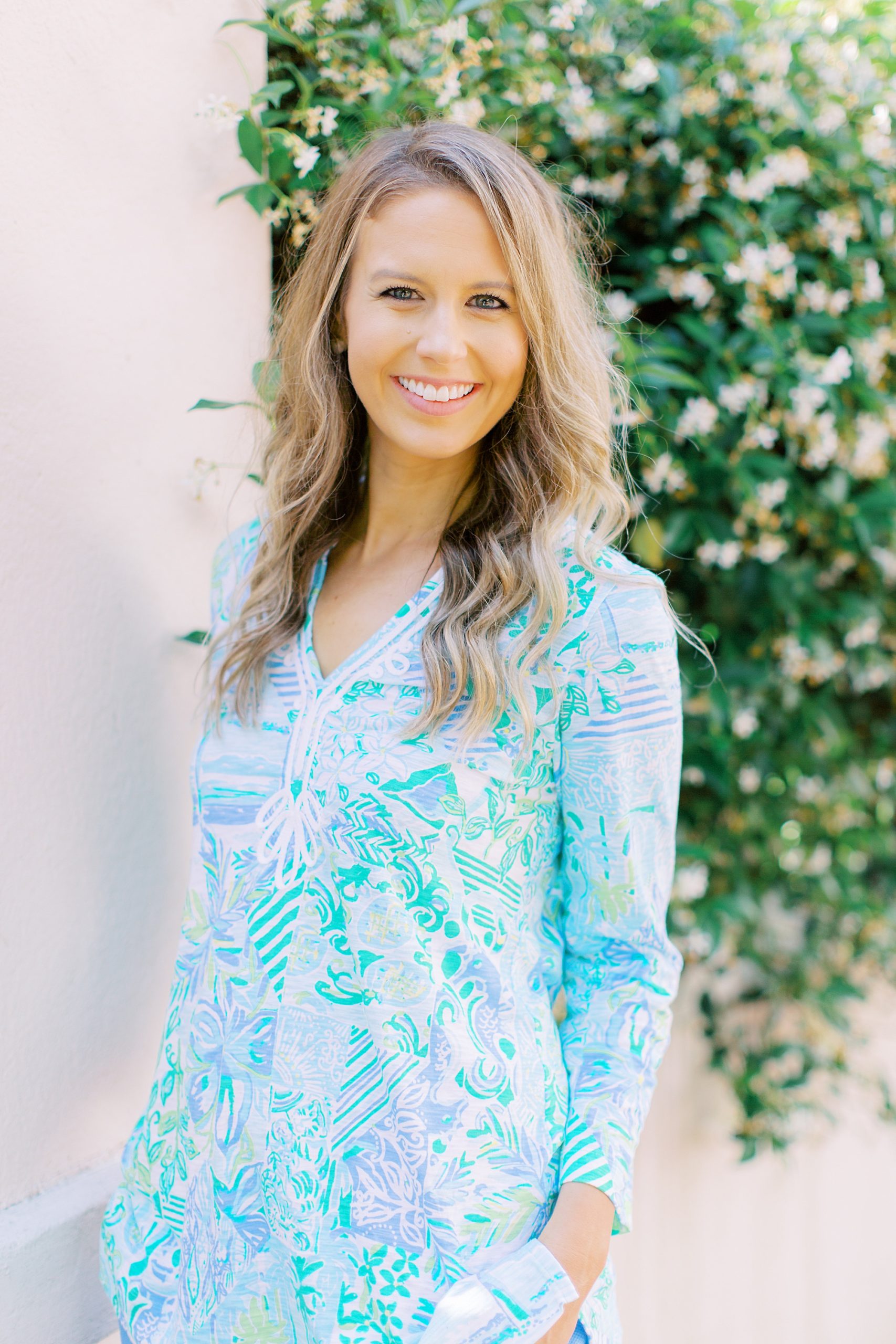 business coach poses in lily Pulitzer outfit in Downtown Charleston