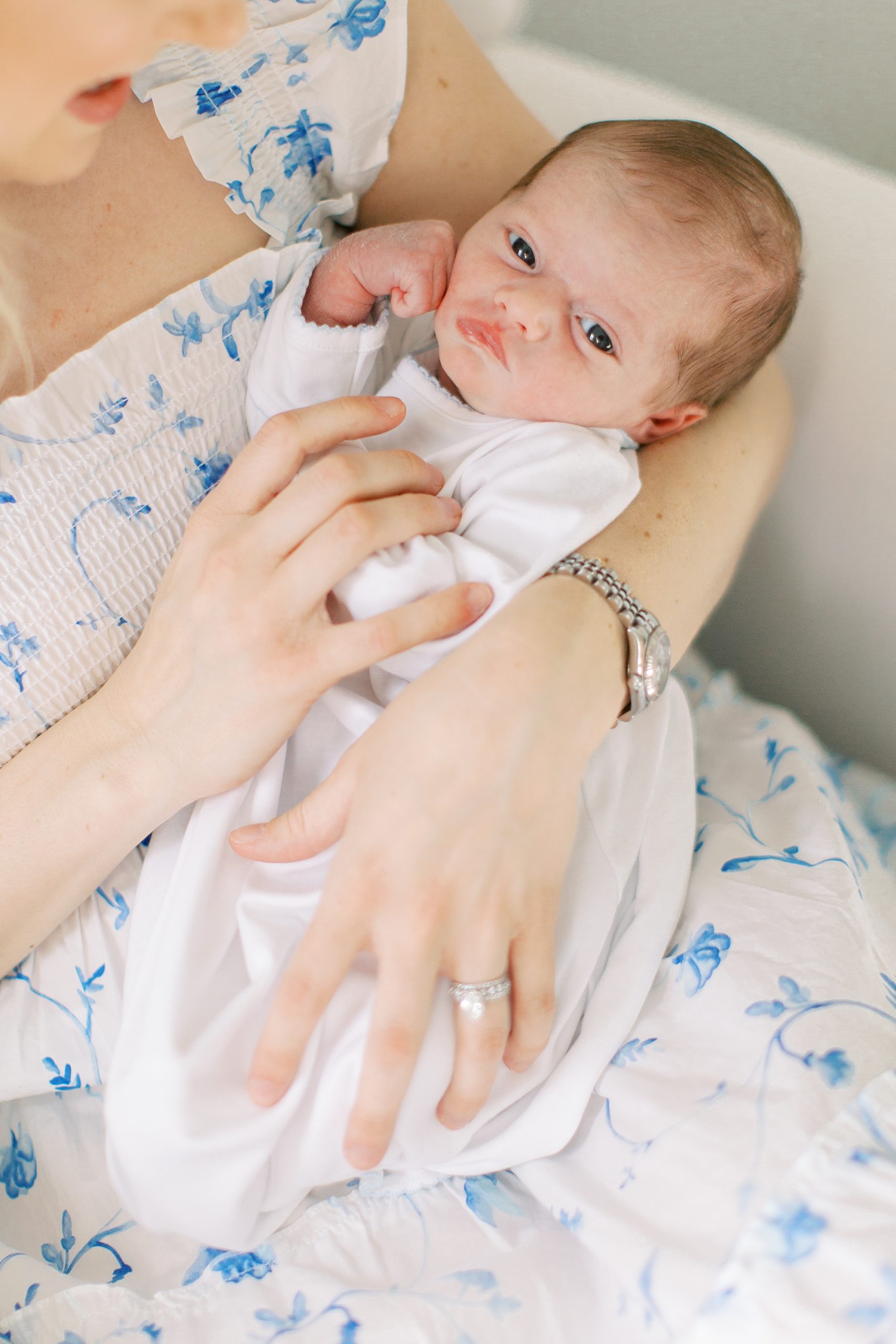 mom rocks baby boy during newborn photos in Charlotte NC