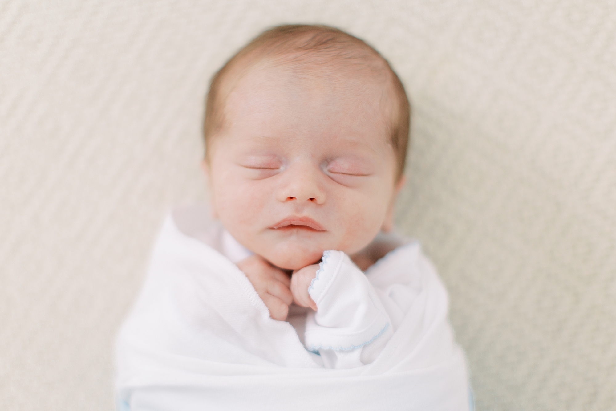 baby sleeps in crib during newborn photos