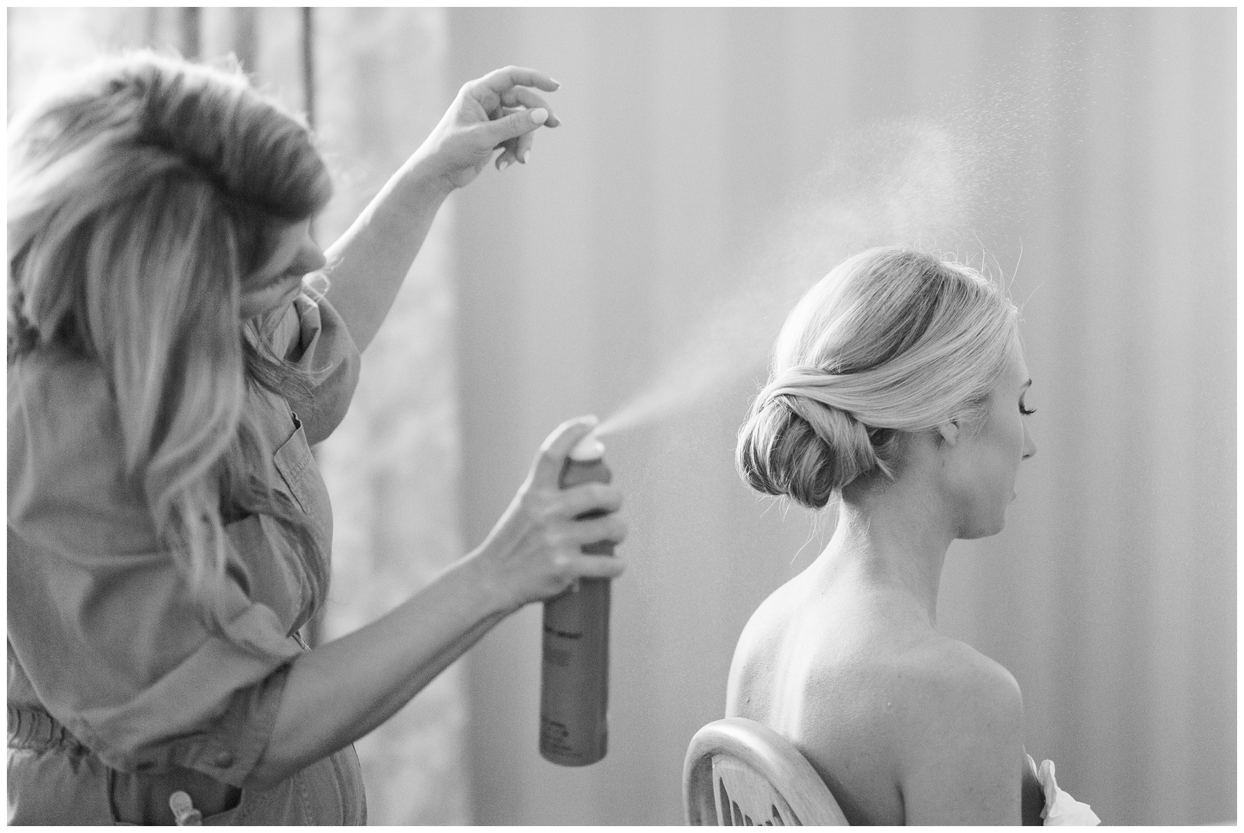 Be Pretty Charlotte sprays bride's hair during prep for Charlotte NC wedding 