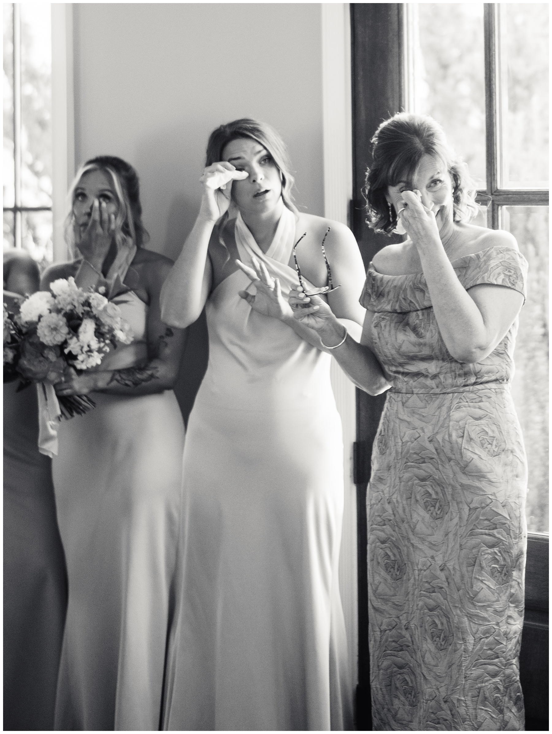 bridesmaids and mother cry looking at bride during prep in New Hill NC