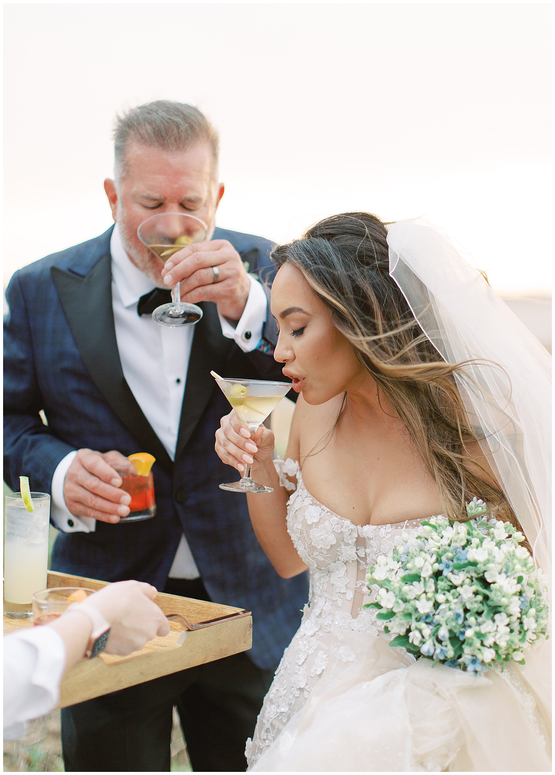 bride and groom taste signature cocktails at Lowndes Grove wedding 