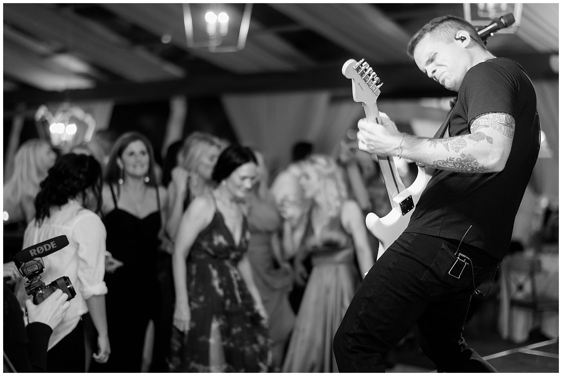 guitarist plays during Charleston wedding reception at Lowndes Grove