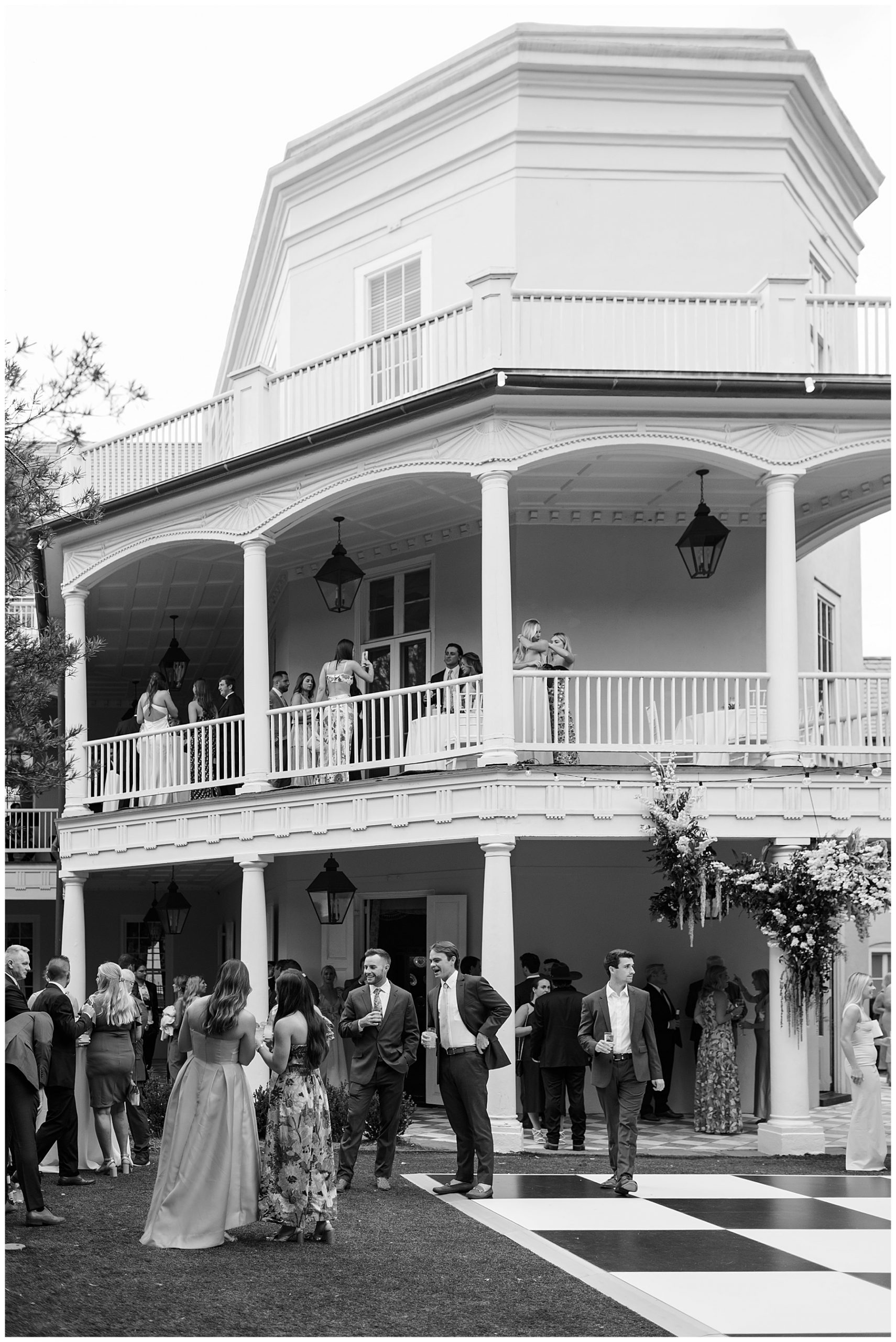 guests mingle on patio, dance floor, and balcony of the William Aiken House