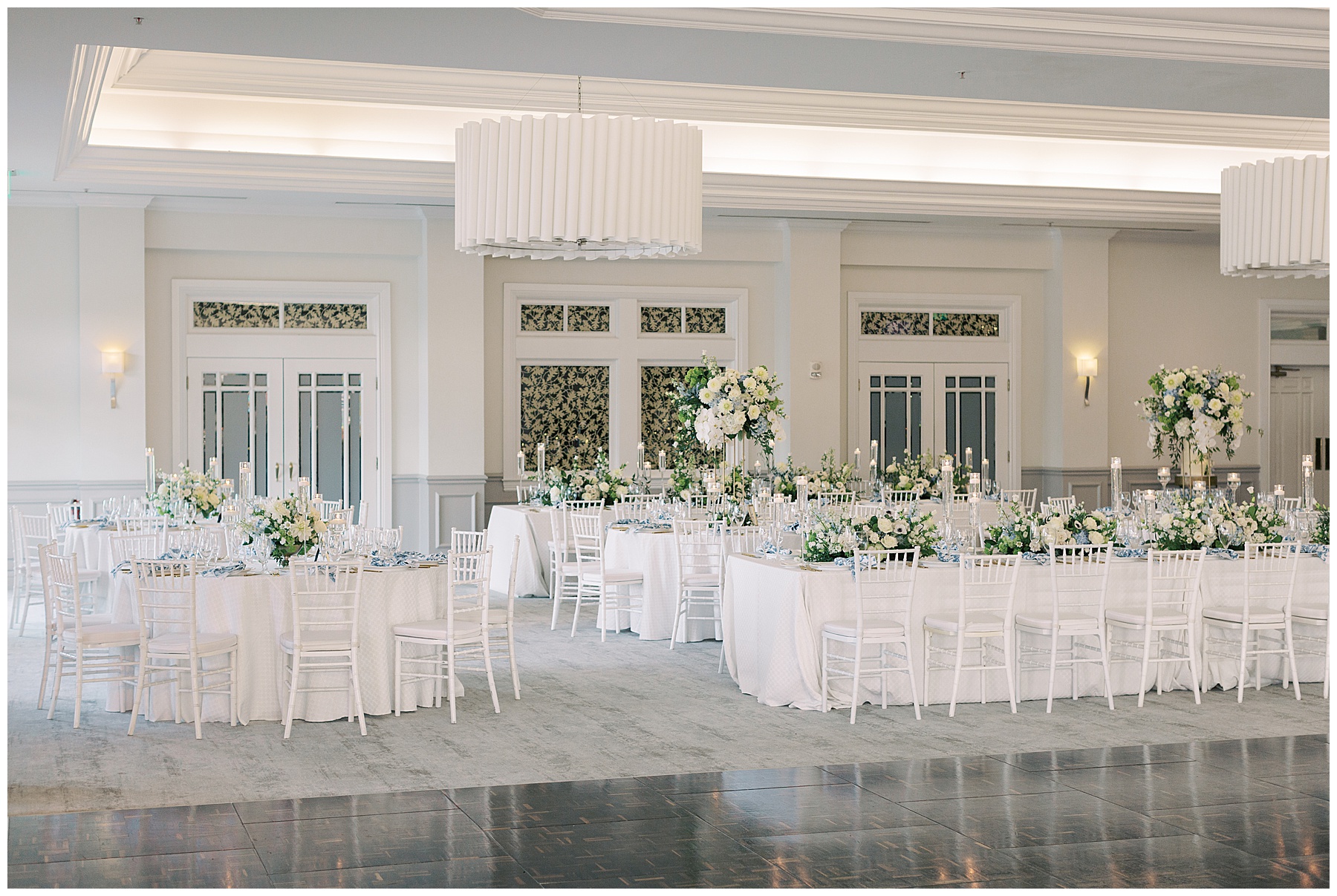 coastal inspired wedding reception with blue and white flowers in ballroom at Grey Oaks Country Club