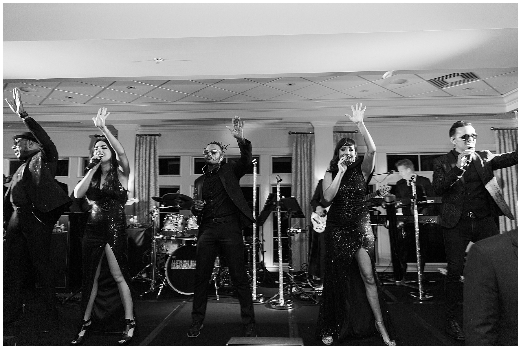 live band performs on stage during reception at Grey Oaks Country Club