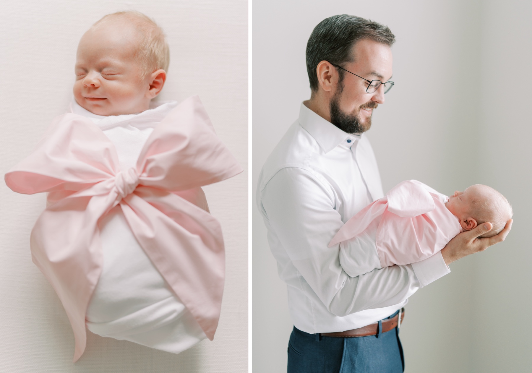 father cradles his baby girl swaddled in a white blanket with a large pink bow during lifestyle newborn photography in Charlotte NC