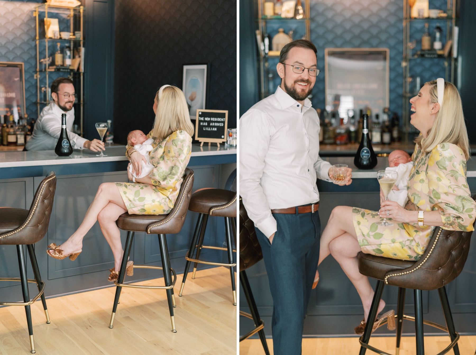 father glides champagne over bar to new mother holding baby girl at home bar