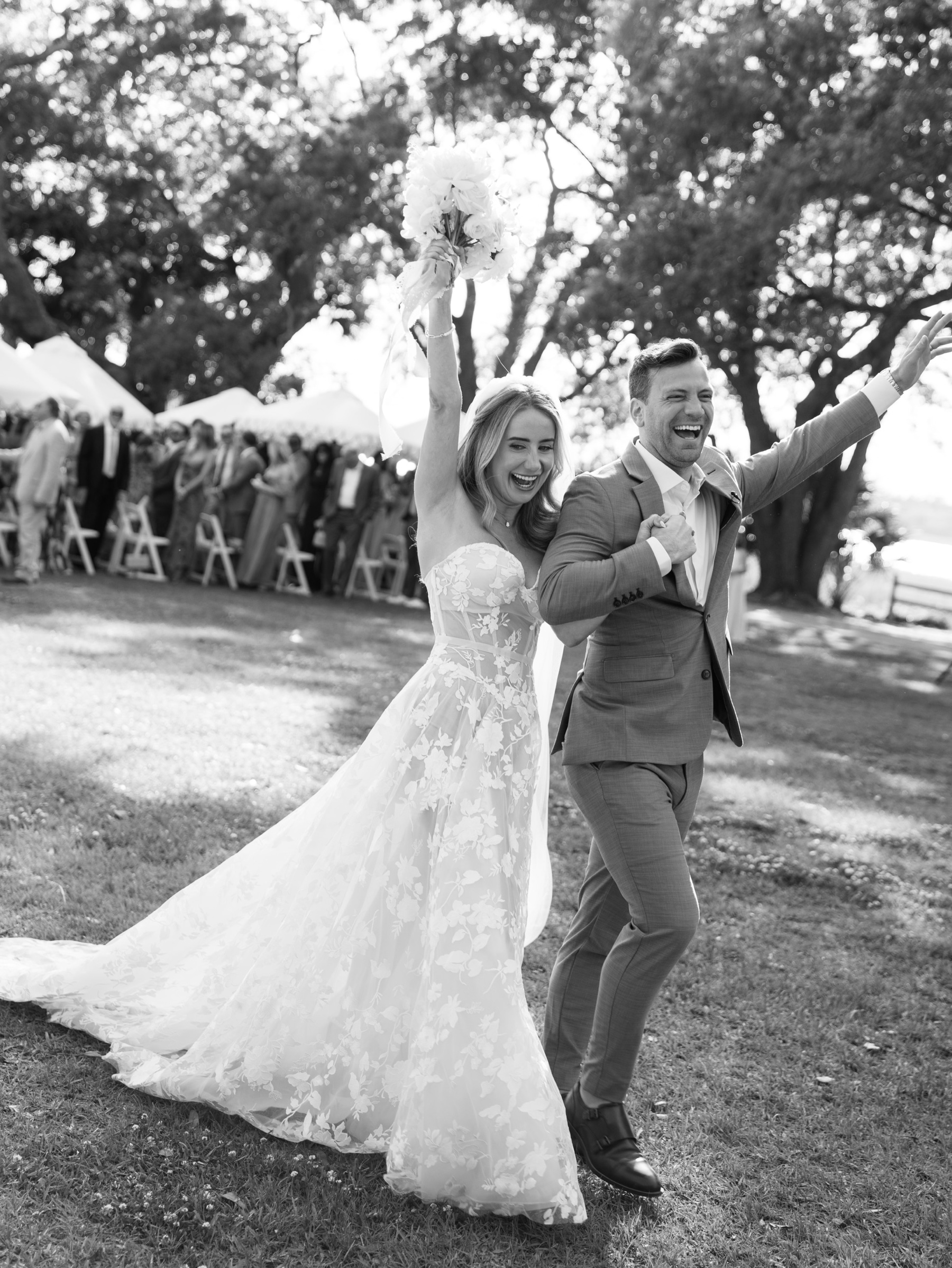 joyful wedding photos of newlyweds celebrating as they exit ceremony