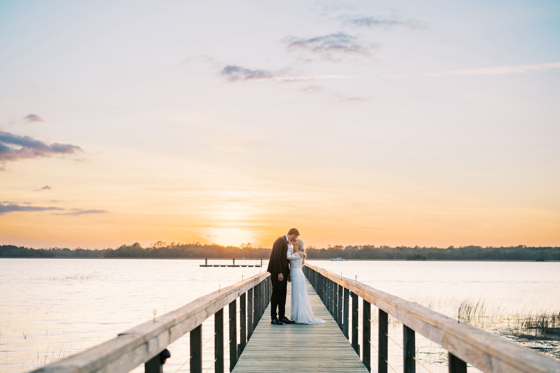 Romantic Coastal Lowndes Grove Wedding photos on a dock over the water