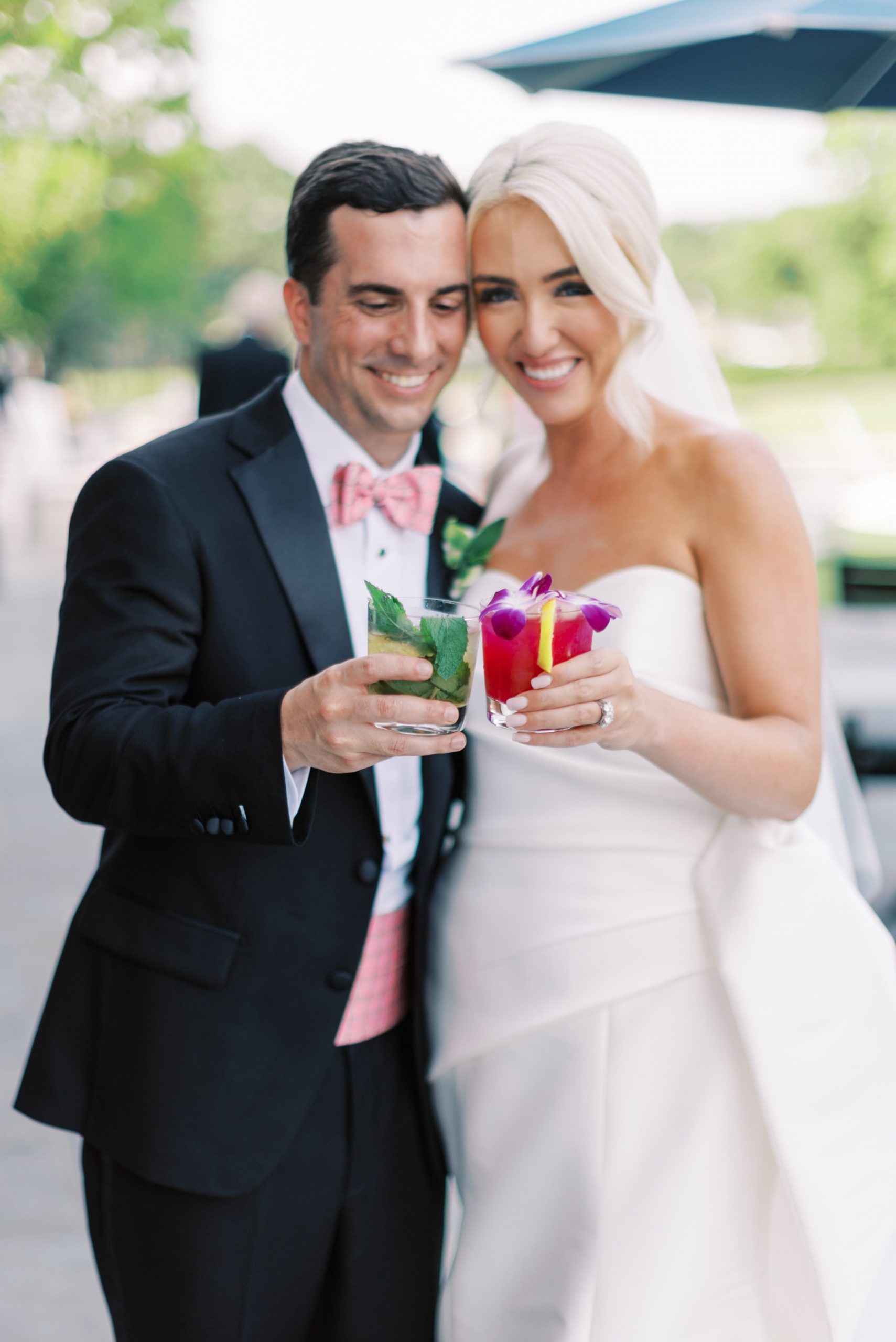 newlyweds toast with a drink