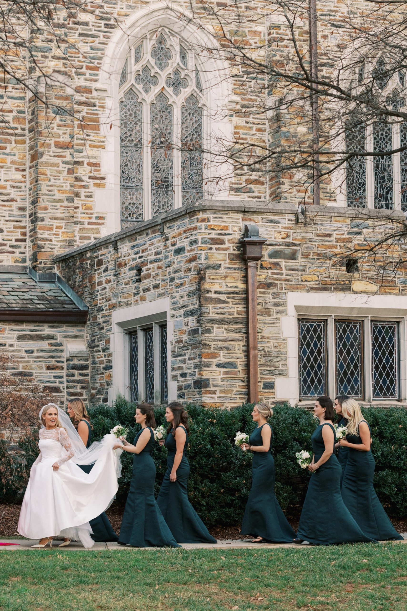 bride and bridesmaids walking outside of church in Charlotte 