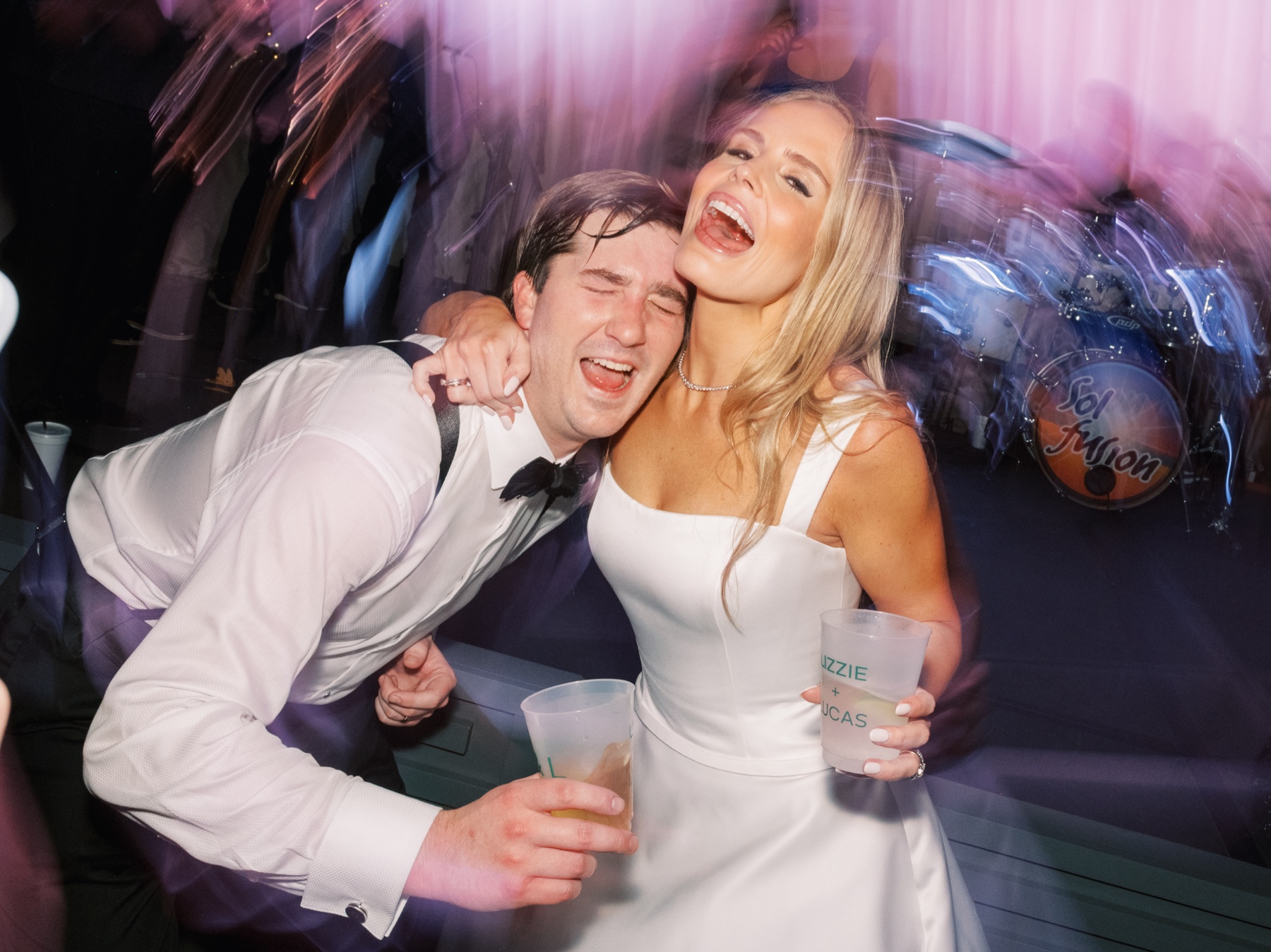 candid wedding reception photos of bride and groom