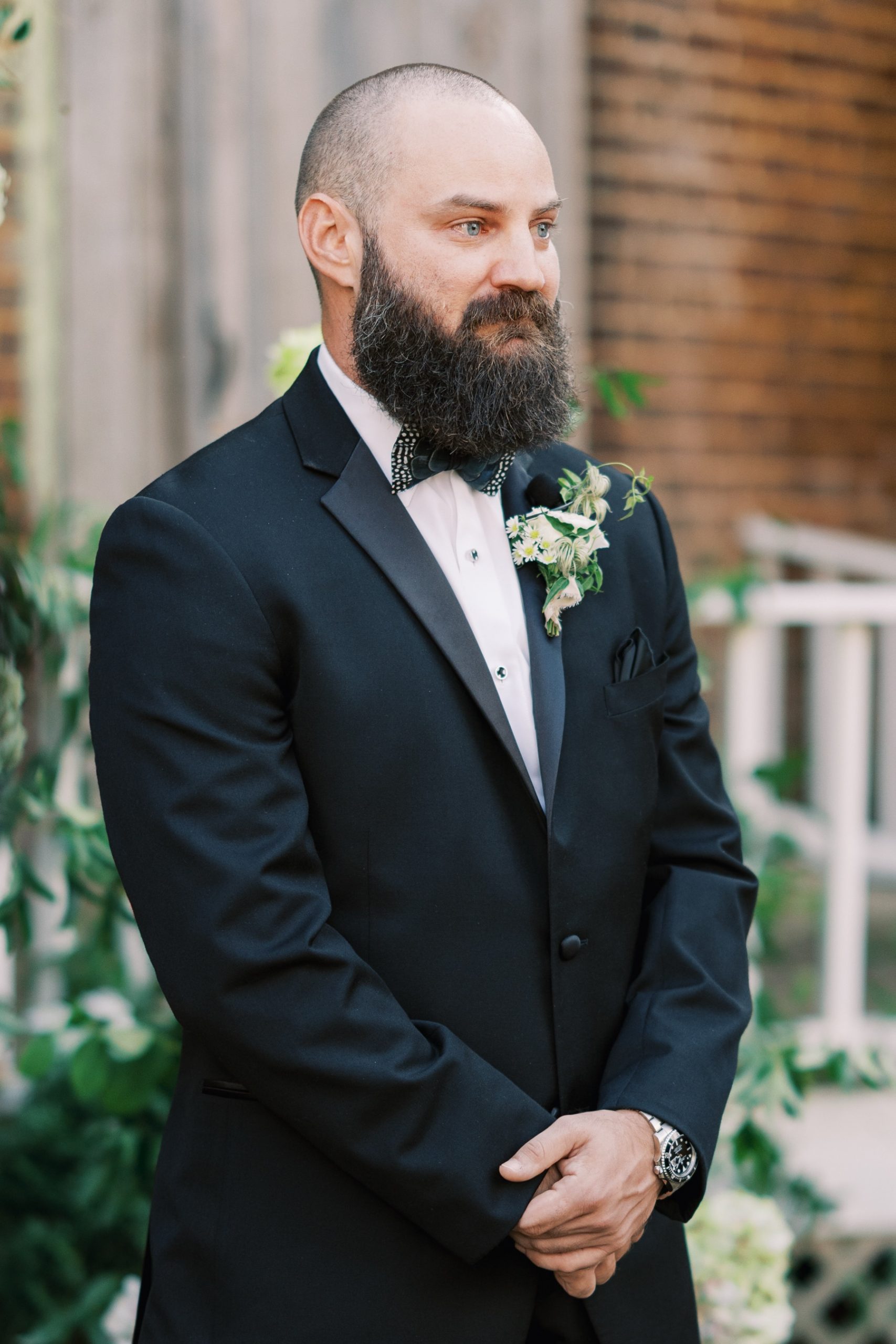 Close up of groom waiting for his bride to walk down the aisle at their Barnsley Resort Wedding