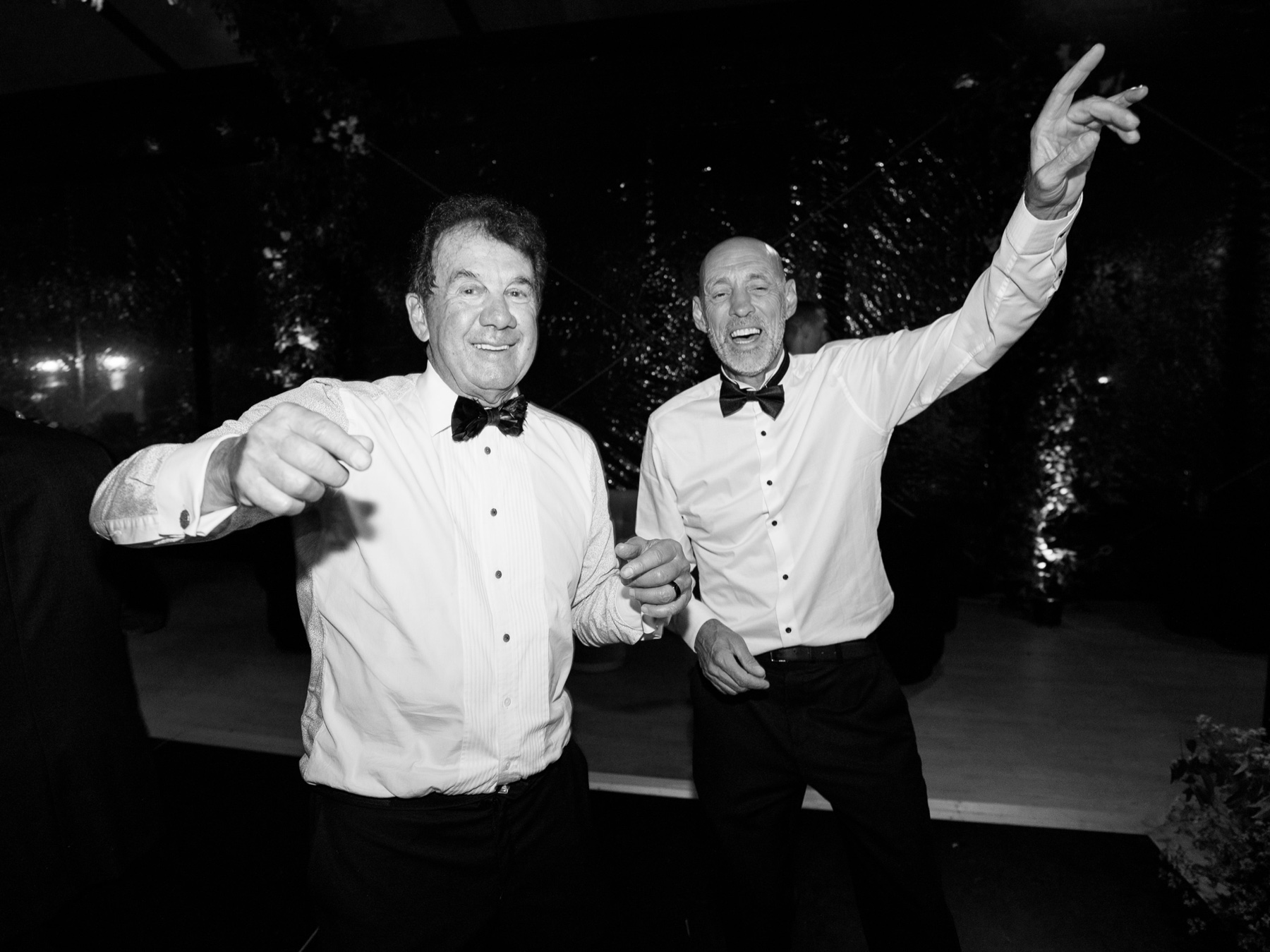Black and white photo of two men enjoying the Barnsley Resort Wedding reception