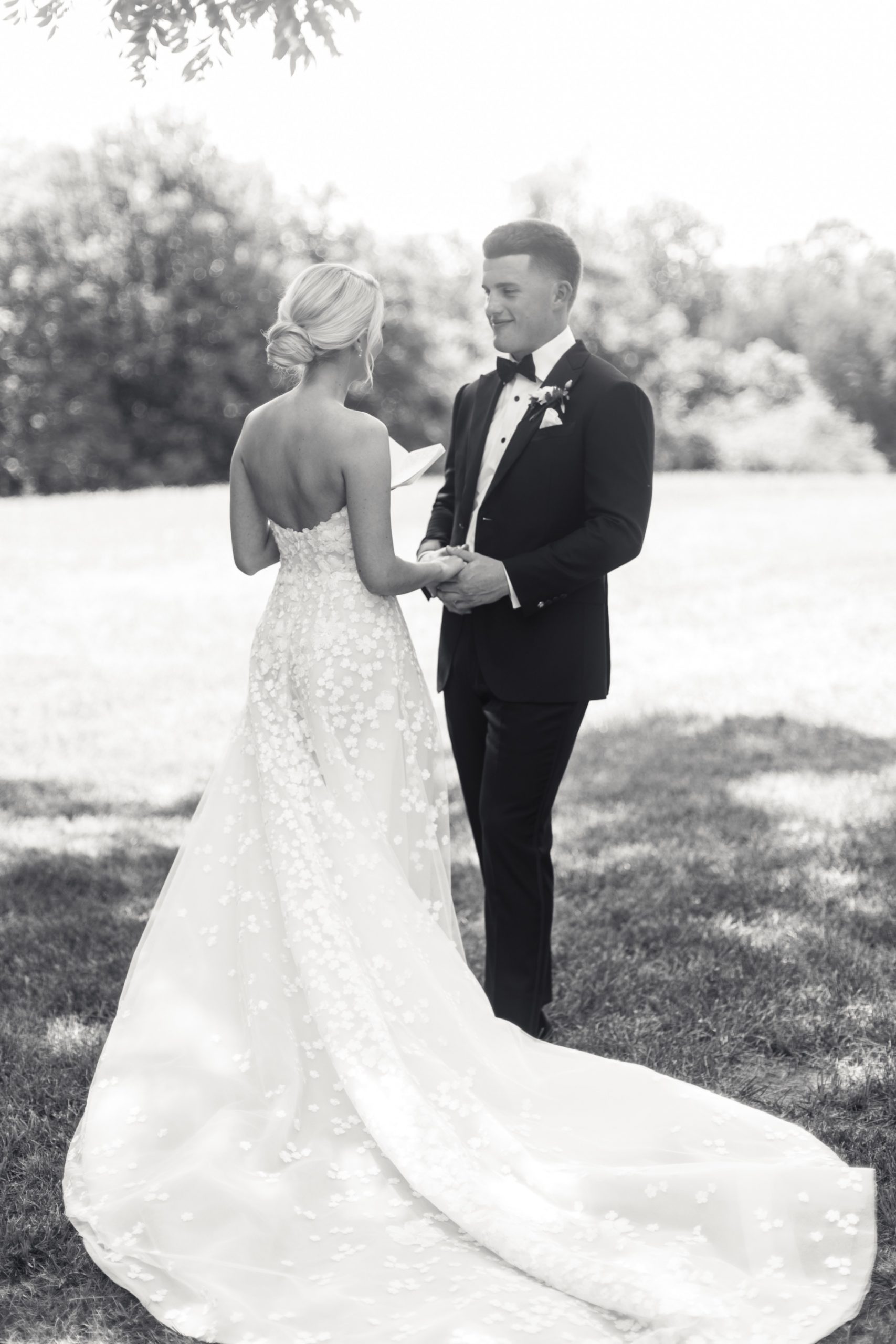 bride and groom holding hands while they exchange private vows at a North Carolina Estate Wedding 