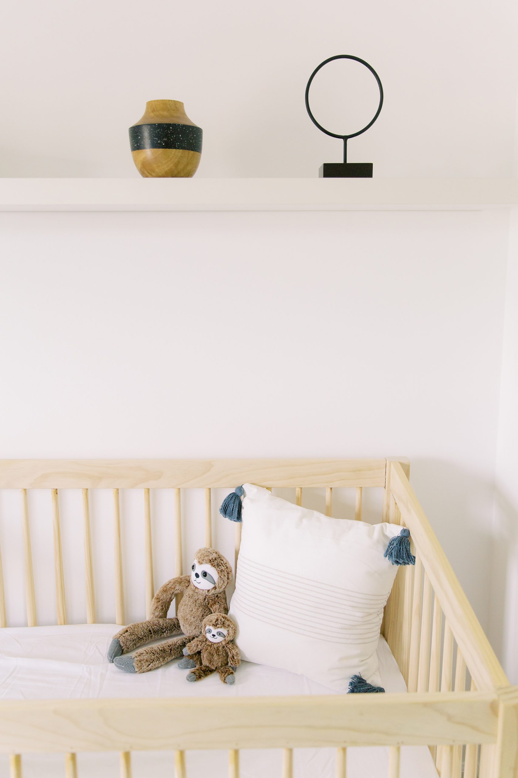 Charlotte lifestyle newborn session in nursery with sloth