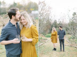 engaged couple enjoys glass of wine during engagement photos in NC