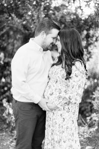 Reynolda Village maternity session with couple laughing together