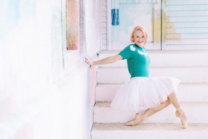 ballerina poses on steps during Charlotte NC branding photos