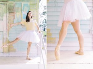 Uptown Charlotte Branding Session with ballerina on steps in front of wall with watercolor splatters