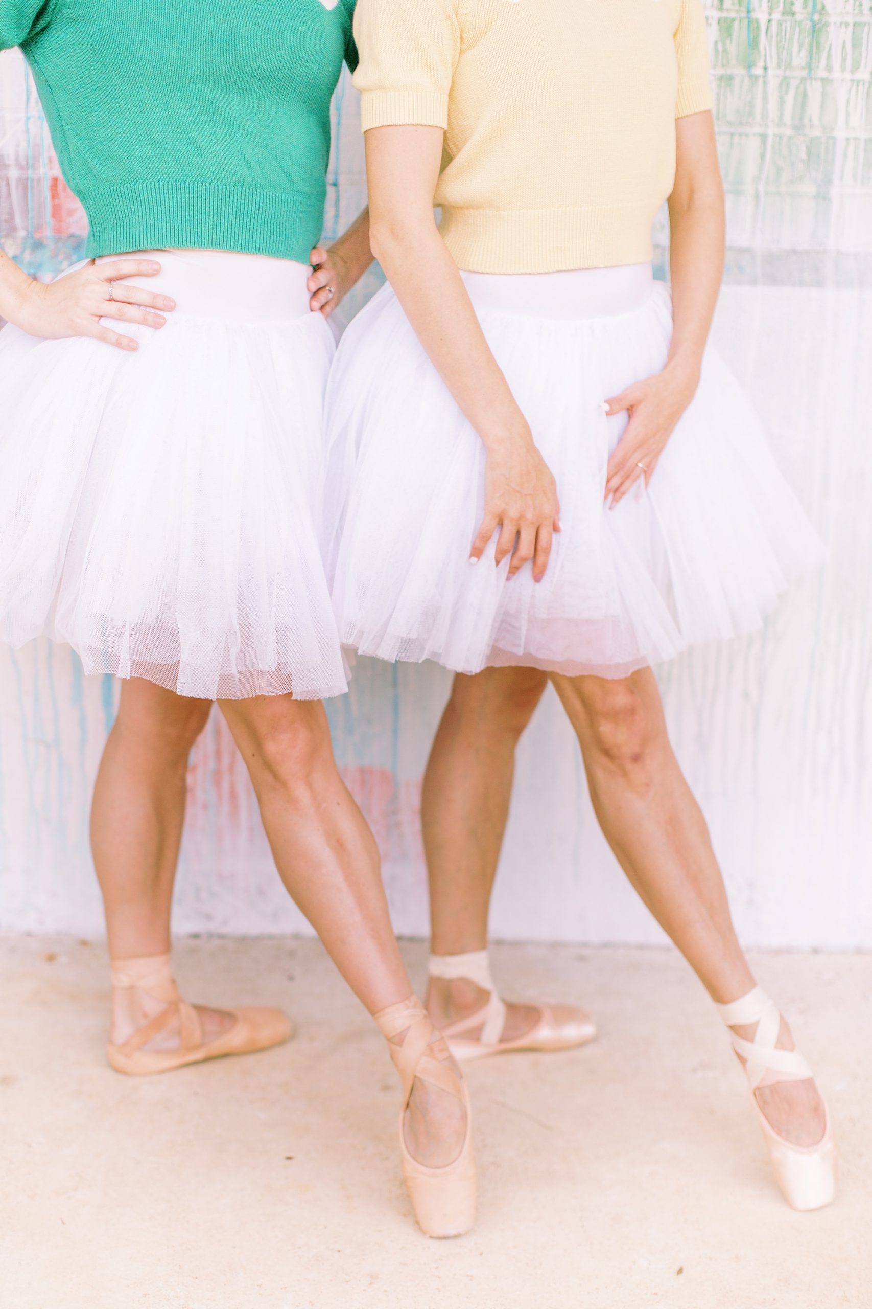 ballerinas point toes in pink tutus