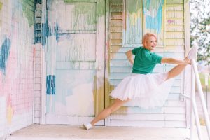 dance teacher does standing splits in tennis shoes