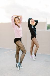 dance teachers pose in tights and leopards