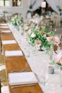 wedding reception details with farmhouse seating