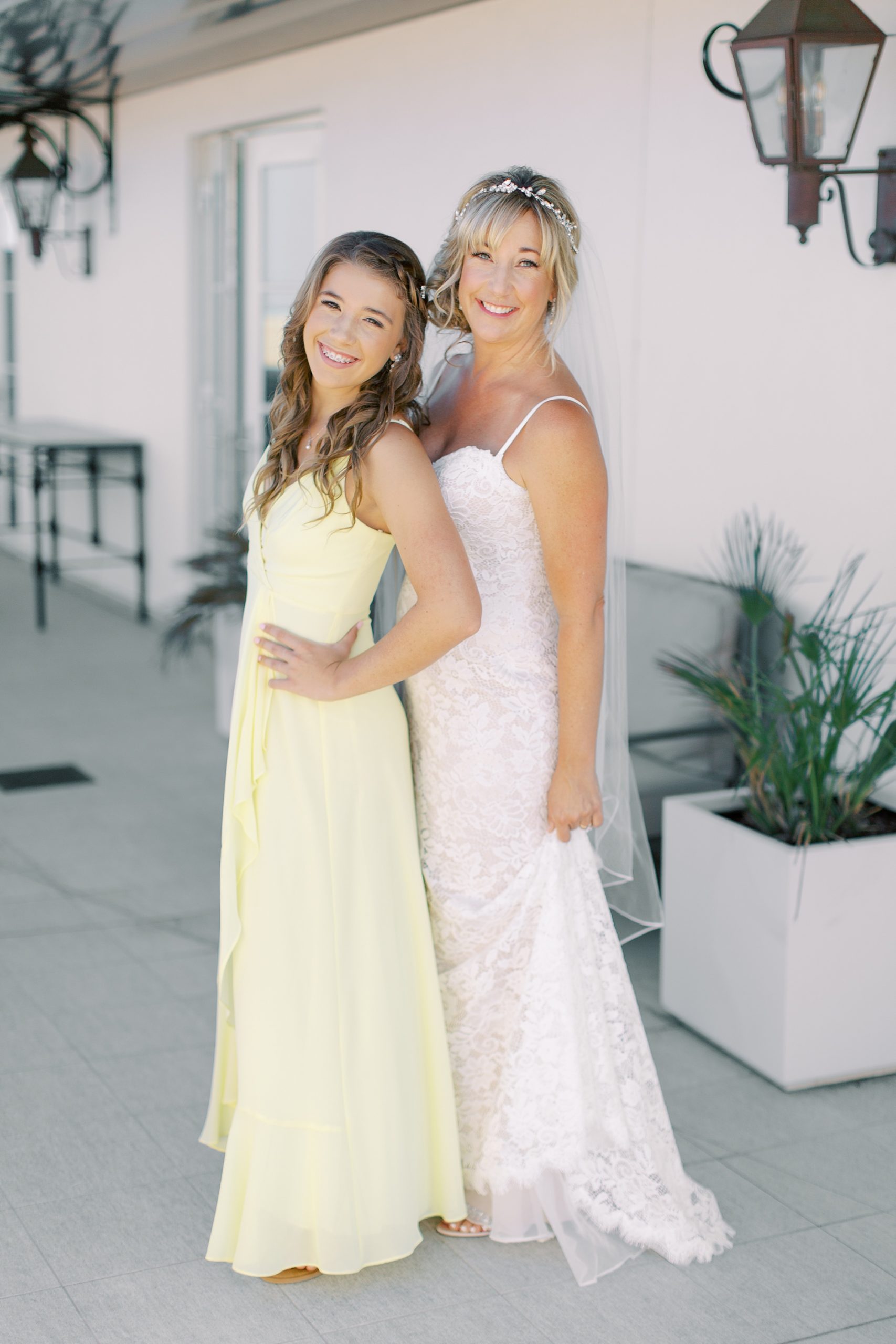bride poses with daughter before Charleston microwedding on Sullivan's Island
