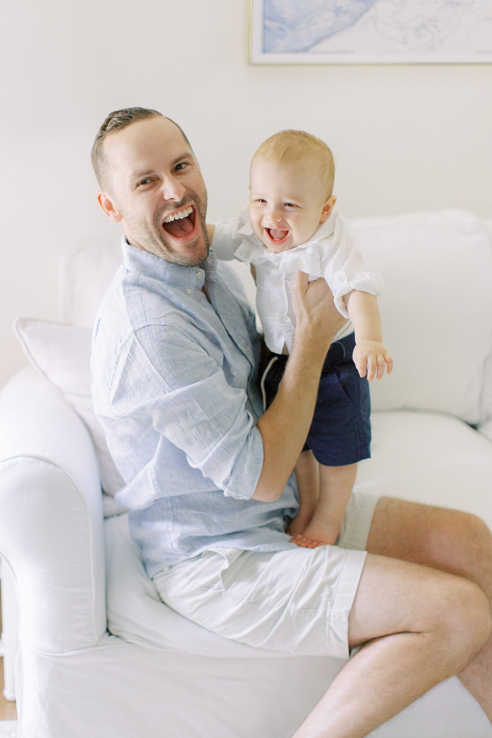 dad laughs with toddler during NC lifestyle portraits