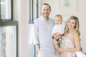 parents hold baby during lifestyle portraits at home