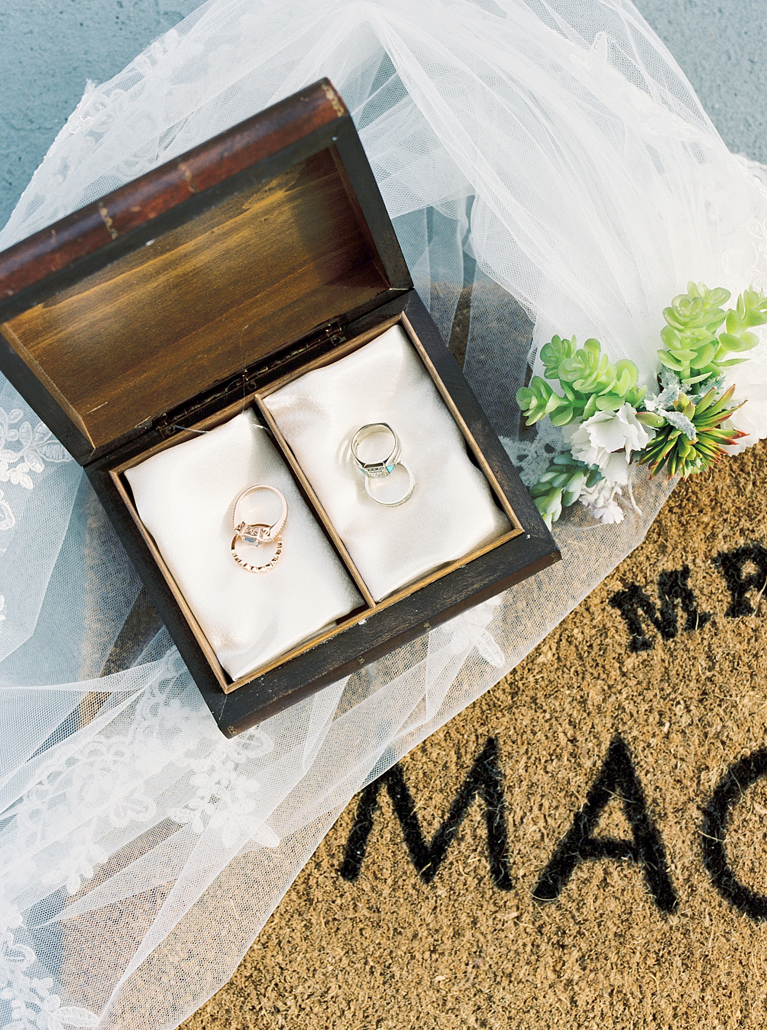bride's rings in wooden box before Charleston microwedding on the beach