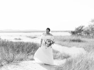 bridal portraits on the sand with tall grass