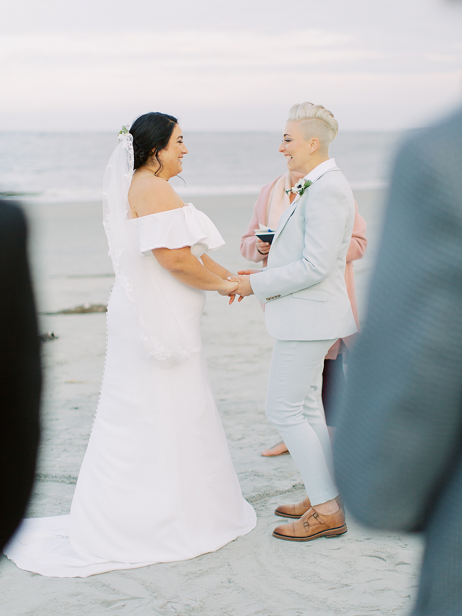 brides exchange vows during intimate Charleston Microwedding ceremony on the beach