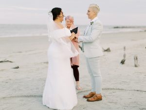 couple exchanges vows during intimate Charleston Microwedding ceremony on the beach